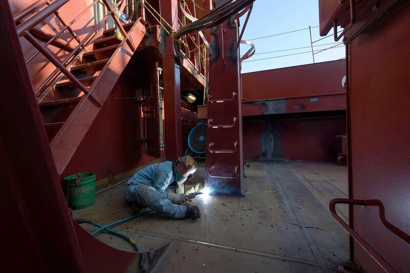 A welder works on an under-construction Maersk triple-E class container ship at the Daewoo DSME shipyard in Okpo, 60km south of Busan, South Korea. At some 400 metres long and capable of carrying over 18,000 containers, triple-E class ships are the largest currently in operation. Expected to be deployed on Maersk’s Asia - Europe routes, the ships use a combination of engine technology and a slower cruising speed to reduce fuel consumption and emissions, and are touted as being considerably more efficient than rival classes. Ed Jones / AFP