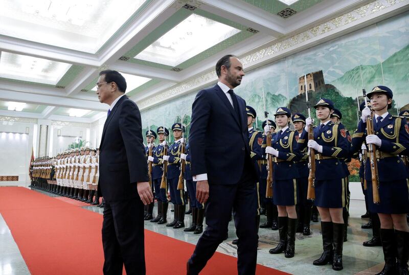 French prime minister Edouard Philippe and China's premier Li Keqiang attend a welcome ceremony at the Great Hall of the People in Beijing. Jason Lee / Reuters