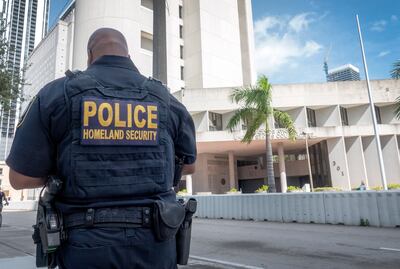 A Homeland Security officer stands in front of the C. Clyde Atkins US Courthouse where Colombian-Venezuelan businessman Alex Saab, the alleged partner of Venezuelan ruler Nicolas Maduro, is scheduled to appear before a US judge in Miami. EPA
