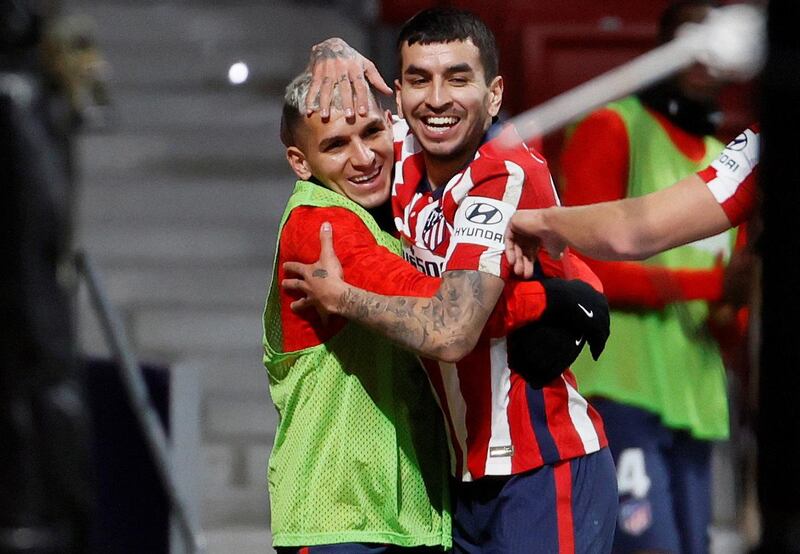 Atletico's striker Angel Correa celebrates with his teammate Lucas Torreira. EPA