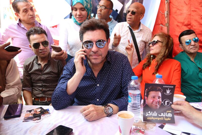 Mandatory Credit: Photo by MAHMOUD AHMED/EPA-EFE/Shutterstock (10351121b)
Head of Egypt's Music Syndicate Hany Shaker (C) attends voting process to elect board members of the Egyptian Musicians Syndicate, in Cairo, Egypt, 30 July 2019 (issued 31 July 2019). Hany Shaker was re-elected for a second term as head of the Egyptian Musicians Syndicate.
Electing board members of the Egyptian Musicians syndicate, Cairo, Egypt - 30 Jul 2019