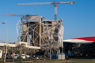 Fire damage marks two cranes at the Clymb Abu Dhabi construction site on Yas Island following a fire last month. The National