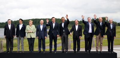 The German Chancellor, third from left at a summit in Northern Ireland in 2013, was sometimes the only woman in the room. AP 