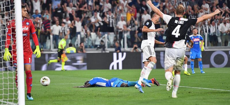 Kalidou Koulibaly sinks to the pitch after his injury time own goal. EPA