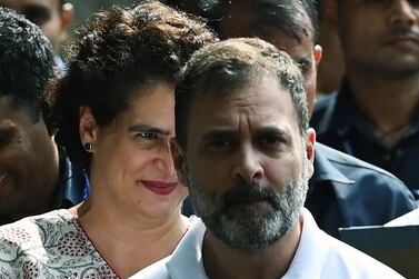 (FILES) In this file photo taken on August 4, 2023, India's Congress party leader Rahul Gandhi (R) arrives with Priyanka Gandhi Vadra (L) at the party headquarters in New Delhi, after the Supreme Court suspended his defamation conviction.  India's main opposition leader Rahul Gandhi was restored to parliament on August 7 after the country's Supreme Court last week suspended his defamation conviction over his political comments on Prime Minister Narendra Modi.  The 53-year-old Congress party leader was sentenced to two years' imprisonment in March in a case that critics flagged as an effort to stifle political opposition in the world's largest democracy.  (Photo by Arun SANKAR  /  AFP)
