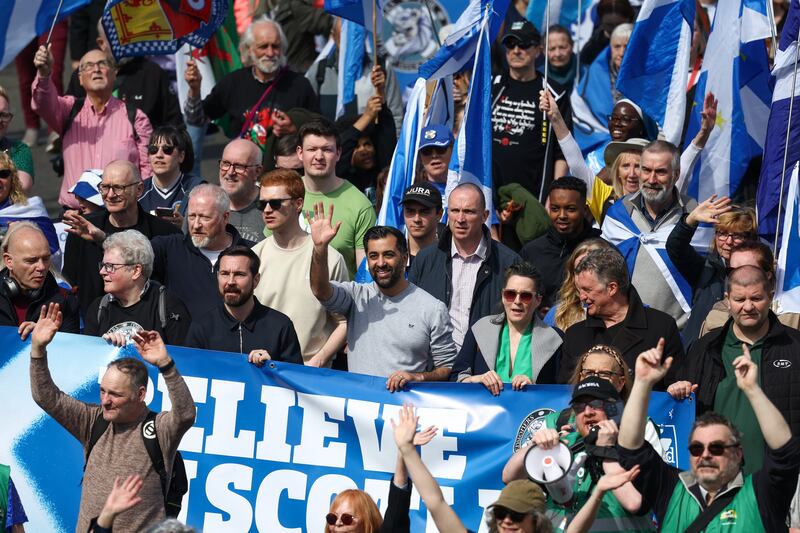 Mr Yousaf joins members of the public as they attend a march in Glasgow calling for an independent Scotland, in April. Getty Images