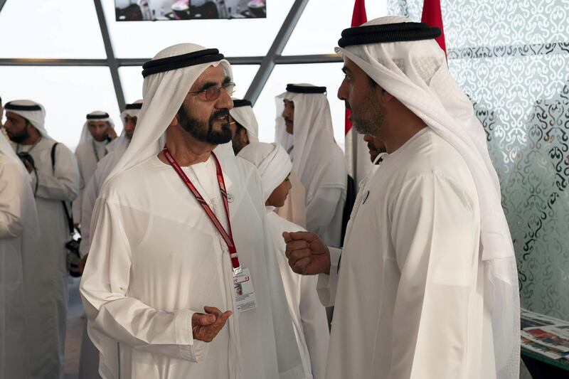 YAS ISLAND, ABU DHABI, UNITED ARAB EMIRATES - November 25, 2018: HH Sheikh Mohamed bin Rashid Al Maktoum, Vice-President, Prime Minister of the UAE, Ruler of Dubai and Minister of Defence (L) speaks with HH Sheikh Hamed bin Zayed Al Nahyan, Chairman of the Crown Prince Court of Abu Dhabi and Abu Dhabi Executive Council Member (R), on the final day of the 2018 Formula 1 Etihad Airways Abu Dhabi Grand Prix, in Shams Tower.

( Ryan Carter / Ministry of Presidential Affairs )
---