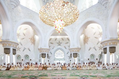 ABU DHABI, UNITED ARAB EMIRATES - June 25, 2017: HH Sheikh Mohamed bin Zayed Al Nahyan, Crown Prince of Abu Dhabi and Deputy Supreme Commander of the UAE Armed Forces (13th L), attends Eid Al Fitr prayers at the Sheikh Zayed Grand Mosque. Seen with (L-R) HH Sheikh Abdullah bin Mohamed bin Khaled Al Nahyan Chairman of Al Ain Club Football Company, HH Sheikh Khaled bin Zayed Al Nahyan, Chairman of the Board of Zayed Higher Organization for Humanitarian Care and Special Needs (ZHO), HH Sheikh Omar bin Zayed Al Nahyan, Deputy Chairman of the Board of Trustees of Zayed bin Sultan Al Nahyan Charitable and Humanitarian Foundation, HH Sheikh Saeed bin Mohamed Al Nahyan, HH Sheikh Abdullah bin Zayed Al Nahyan, UAE Minister of Foreign Affairs and International Cooperation, HH Sheikh Hamed bin Zayed Al Nahyan, Chairman of the Crown Prince Court of Abu Dhabi and Abu Dhabi Executive Council Member, HH Sheikh Mansour bin Zayed Al Nahyan, UAE Deputy Prime Minister and Minister of Presidential Affairs, HH Sheikh Tahnoon bin Zayed Al Nahyan, UAE National Security Advisor, HH Lt General Sheikh Saif bin Zayed Al Nahyan, UAE Deputy Prime Minister and Minister of Interior, HH Sheikh Nahyan Bin Zayed Al Nahyan, Chairman of the Board of Trustees of Zayed bin Sultan Al Nahyan Charitable and Humanitarian Foundation, HH Sheikh Saeed bin Zayed Al Nahyan, Abu Dhabi Ruler's Representative, HH Sheikh Hazza bin Zayed Al Nahyan, Vice Chairman of the Abu Dhabi Executive Council, HH Sheikh Mohamed bin Zayed Al Nahyan, Crown Prince of Abu Dhabi and Deputy Supreme Commander of the UAE Armed Forces, HH Sheikh Saif bin Mohamed Al Nahyan, HH Sheikh Suroor bin Mohamed Al Nahyan, HH Sheikh Mohamed bin Butti Al Hamed, HH Sheikh Nahyan bin Mubarak Al Nahyan, UAE Minister of Culture and Knowledge Development, HH Sheikh Rashid bin Hamdan bin Mohamed Al Nahyan, HH Dr Sheikh Hamed bin Ahmed Al Hamed, Chairman of Al Qudra Holding, HH Sheikh Nahyan bin Hamdan bin Mohamed Al Nahyan, HH Sheikh Zayed bin Nahyan bin Z