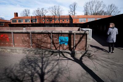 School principal Claus Moeller at Stengaard School in Gladsaxe, Denmark, inspects the courtyard as  preparations are under way on April 14, 2020 for the reopening of the school for the pupils from first to fifth grade, after the new coronavirus / Covid-19 lockdown. Nurseries, kindergartens and schools up to fifth grade in Denmark will reopen from April 15, 2020. - Denmark OUT
 / AFP / Ritzau Scanpix / Liselotte Sabroe
