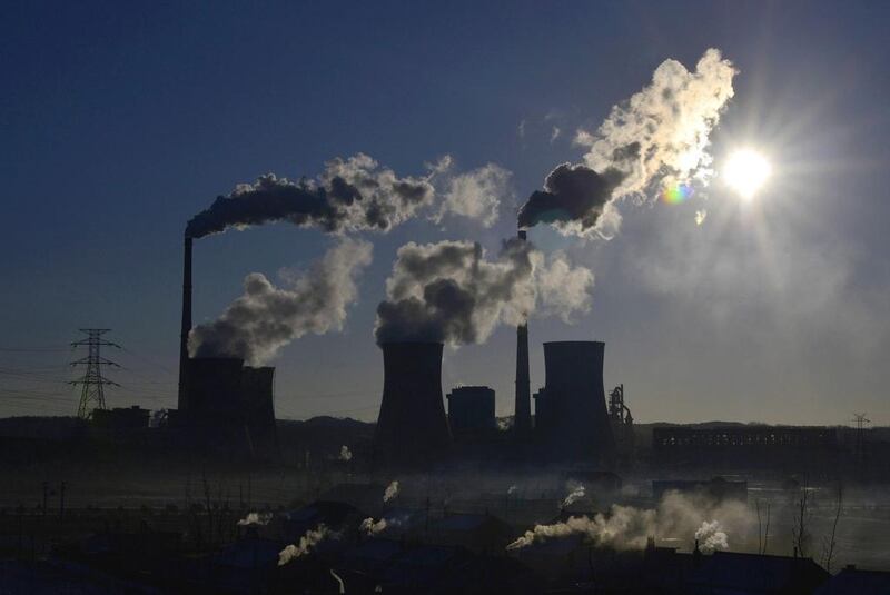 Smoke rises from chimneys and cooling towers of a thermal power plant in Fushun, Liaoning province. Almost all Chinese cities monitored for pollution last year failed to meet state standards. Reuters