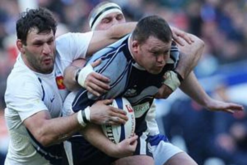 The France lock Lionel Nallet, left, grapples with Allan Jacobsen, the Scotland prop, during Les Bleus' 22-12 win at the Stade de France.