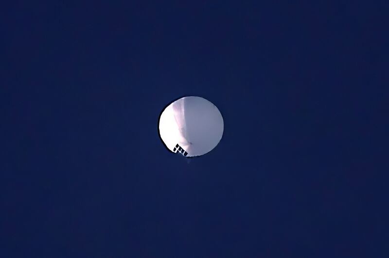 A high-altitude balloon floats over Billings, Montana.  The US is tracking a suspected Chinese surveillance balloon that has been spotted over American  airspace for a couple days, but the Pentagon decided not to shoot it down due to risks of harm for people on the ground, officials said.  The Pentagon would not confirm that the balloon in the photo was the surveillance balloon. AP