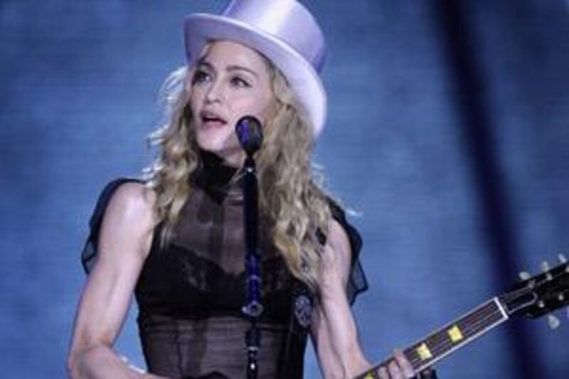 Madonna displayed her too-fit-for-50 arms during a performance in London last month.