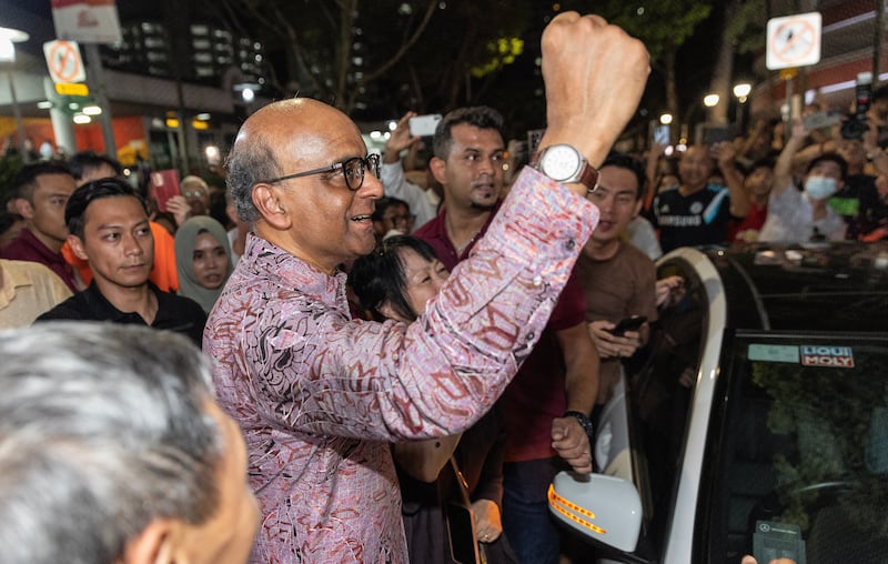 Tharman Shanmugaratnam waves to supporters while waiting for elections results. EPA