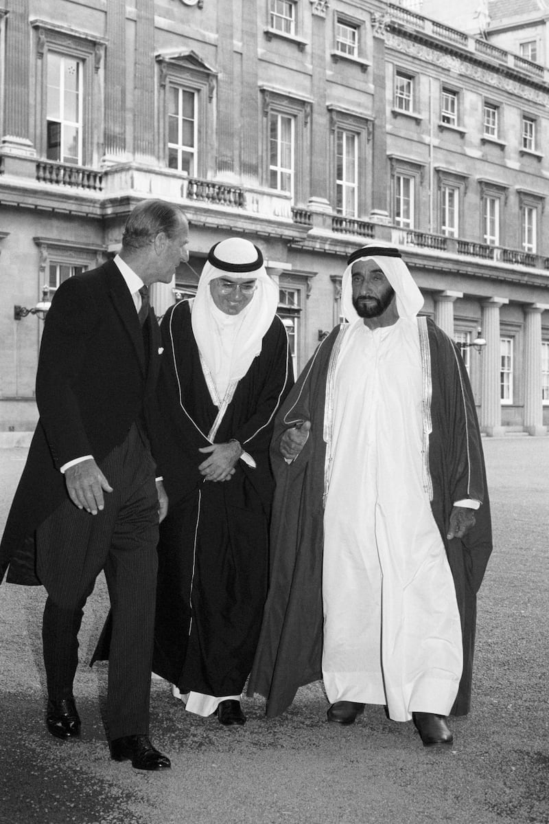 July 18, 1989 - Sheikh Zayed bin Sultan Al-Nahayan chats with Prince Philip with the aid of an interpreter at Buckingham Palace The President is on an official four-day visit to Britain.