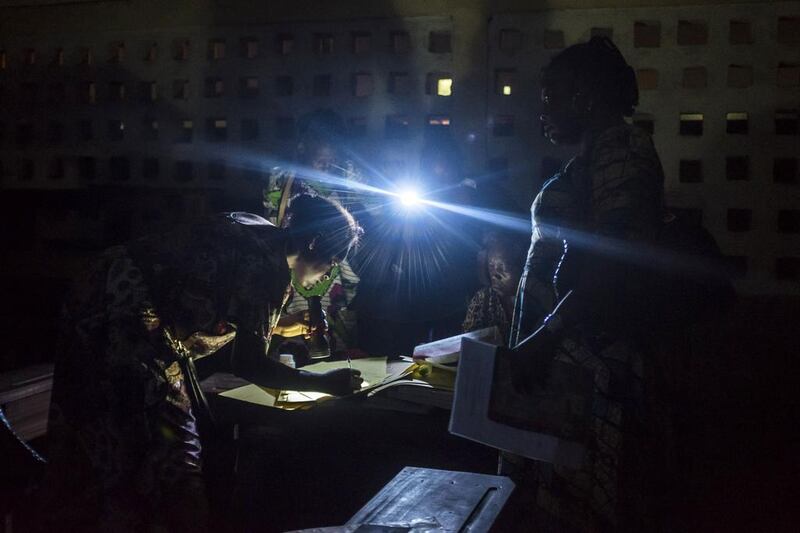 Polling station officials at the Pierre Ntsiete Primary School in Brazzaville prepare to close the polling stations during the vote for the presidential election. Eduardo Soteras / AFP