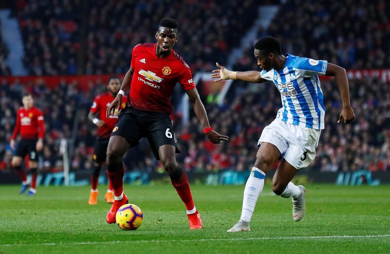 Pogba in action with Huddersfield Town's Terence Kongolo. Action Images via Reuters