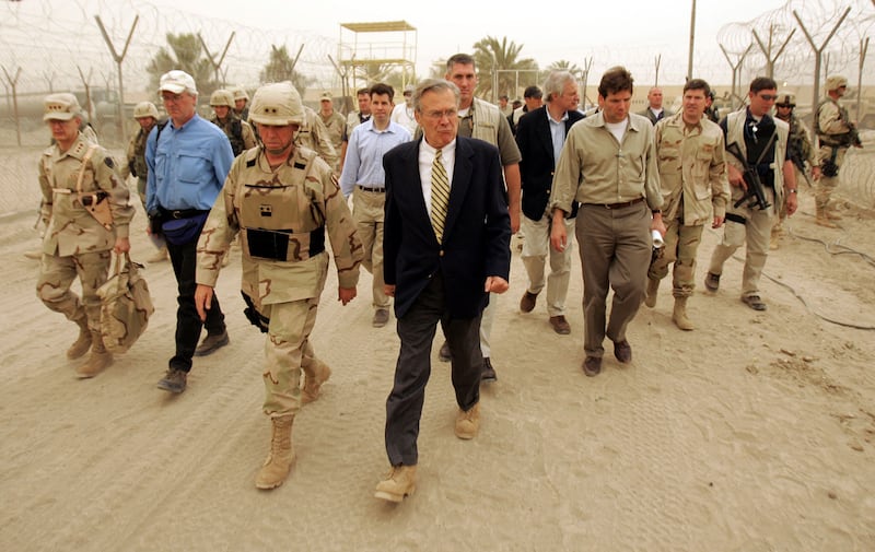 Donald Rumsfeld, right, and Major General Geoffrey Miller, deputy director of detainee operations, visit the Abu Ghraib Prison near Baghdad in May 2004. AFP
