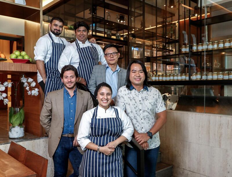 Dubai, UAE, February 19,2018.  Andre (the boss) of Baker & Spice café Al Manzil Mall Dubai  and some of his team for a feature story.  (L-R) from back row: Manish Gajara, Sumanta Roy, Adrian Chow and Deejay Leon, (front) Andre Gerschel and Aaliyah Randeree.
Victor Besa / The National
Business
Reporter:  Kevin Hacket