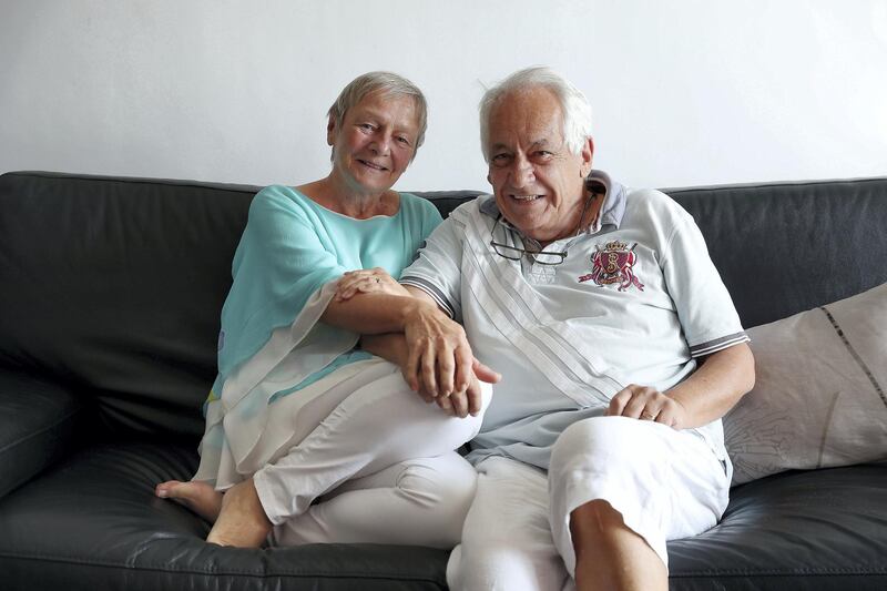 DUBAI , UNITED ARAB EMIRATES , December 11  ��� 2018 :- John Felton, a retired lawyer who is now a children���s author with his wife Heinke Felton at his apartment at the Cayan Tower  in Dubai Marina in Dubai. ( Pawan Singh / The National ) For Business. Story by David