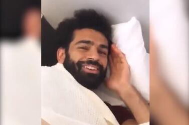 Mohamed Salah tries to take a nap on the flight to Spain. Courtesy Instagram