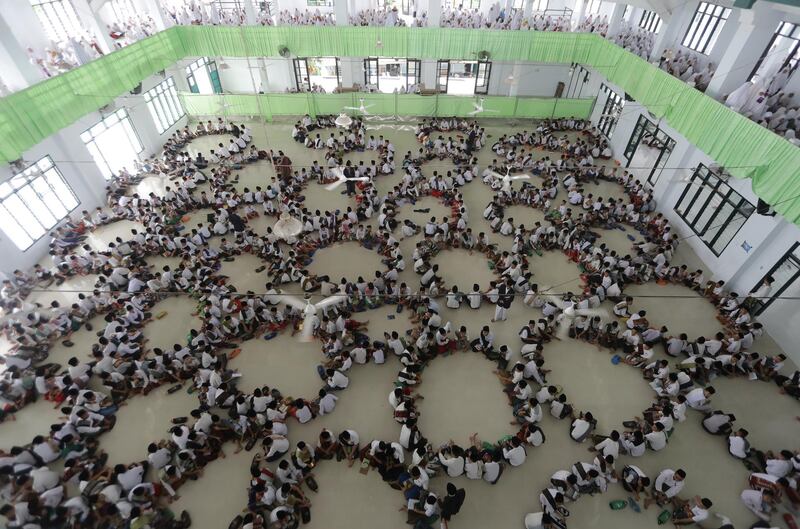 Students from Ar-Raudhatul Hasanah Pesantren religious school read the Quran during the holy month of Ramadan in Medan, Indonesia. YT Haryono / Reuters