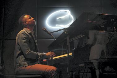 David Davis, The US pianist and singer performing with his band members at the Qs bar at the Palazzo Versace hotel in Dubai. Pawan Singh / The National 