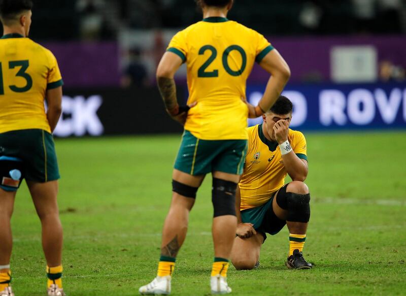 Australia players react after their 40-16 loss to England in the Rugby World Cup quarterfinal match at Oita Stadium in Oita, Japan. AP Photo