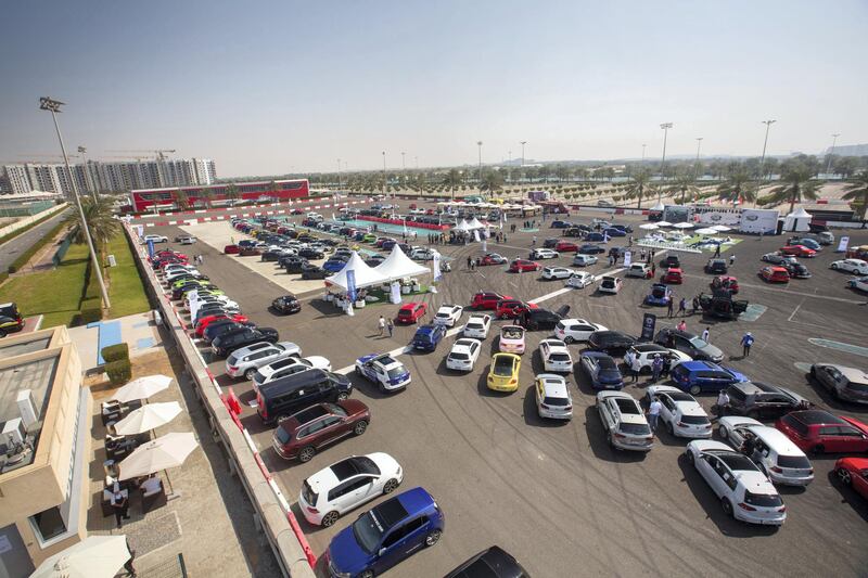 Marshals allot spaces for the hundreds of cars.