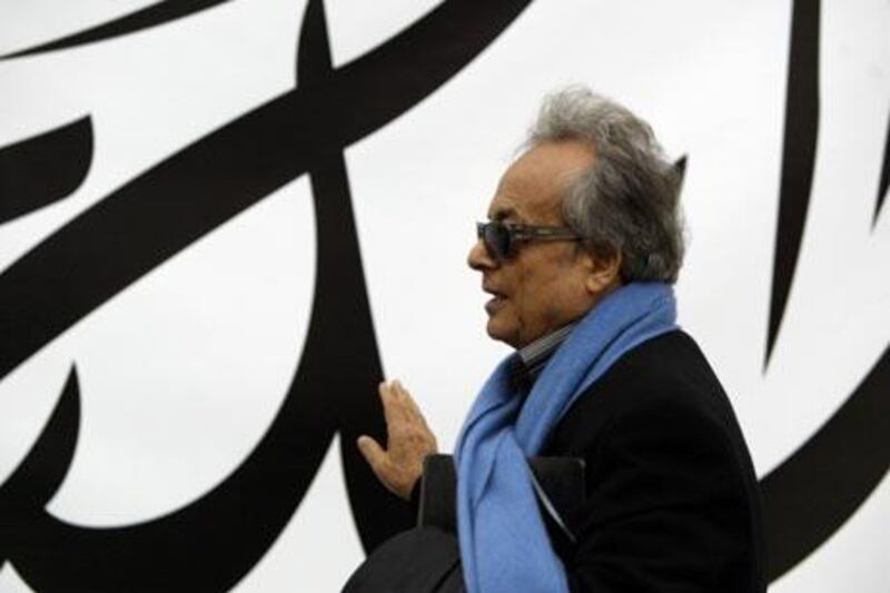 Syrian poet Adonis (Ali Ahmad Said Asbar) walks past giant Arabic script as he arrives for a poetry reading at theFrankfurt Book Fair 08 October 2004. Adonis had been touted as a possible winner of the Nobel prize for literature. The Arab world is the fair's guest of honour this year. The fair running through 10 October, will draw some 6 600 exhibitors from 111 countries showing 350 000 titles and attract an expected 300 000 visitors.