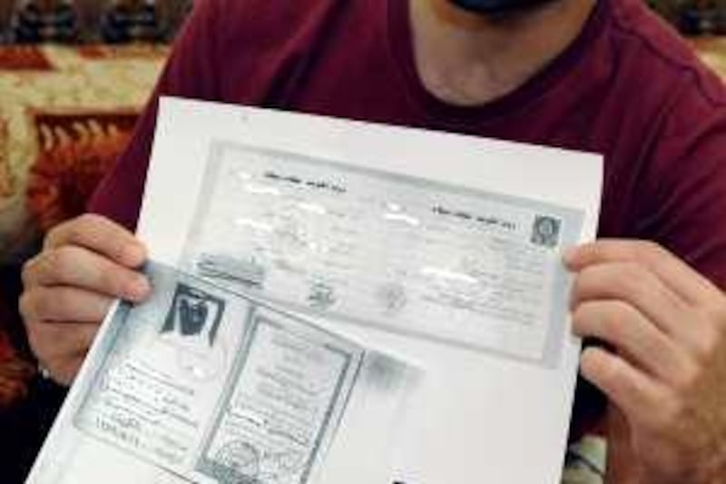 Abdullah, Yara's father, shows the copies of the identification papers provided by the government, at his house in Ahmadi , Kuwait on Feb.23, 2010. (Photo/Gustavo Ferrari/The National)