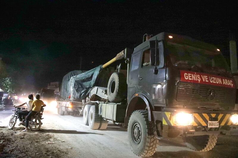 A convoy of Turkish military vehicles head towards the northern Syrian town of Atareb in Syria's northwestern Aleppo province. AFP