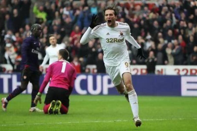Michu, above, and Danny Graham scored for Swansea City at Stamford Bridge in their 2-0 win in the Capital One Cup first leg against Chelsea.