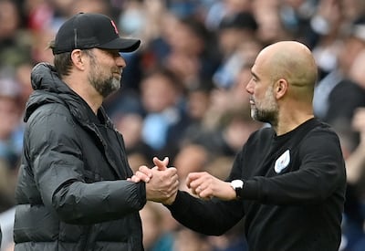 Jurgen Klopp, left, takes Liverpool to face Pep Guardiola and Manchester City at the Etihad. AFP