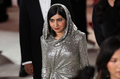 Malala Yousafzai walks the champagne-coloured carpet at the Oscars.  Reuters