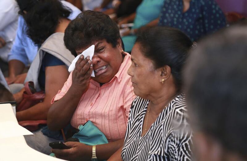 Samudra Hettarachchi, in pink, told of the awful phone call she received from her husband saying his final goodbyes and not knowing if he would be alive a minute later. Rukmal Gamage/ AP Photo