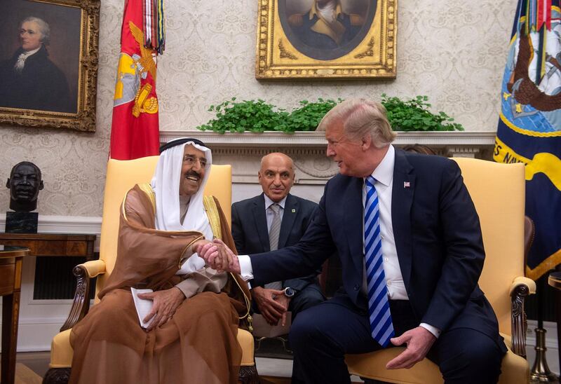 US President Donald Trump shakes hands with the Emir of Kuwait Sheikh Sabah al-Ahmad al-Jaber al-Sabah in the Oval Office at the White House in Washington, DC, on September 5, 2018. (Photo by NICHOLAS KAMM / AFP)