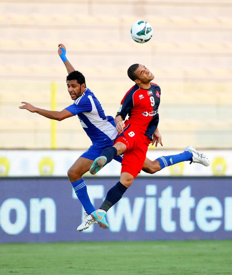 Rodrigo Souza Silva of Al Shaab and Ahmed Ali of Al Nasr  leap for the ball during the Etisalat Pro League match between Al Nasr and Al Shaab at Zabeel Stadium, Dubai on the 3rd November 2012. Credit: Jake Badger for The National