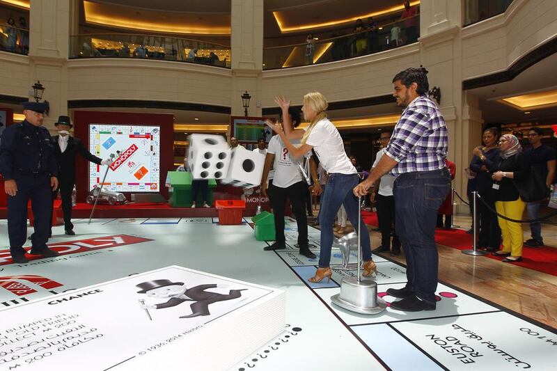 Each player is given one of the familiar 'tokens', such as a hat, dog, thimble or racing car, and they throw a large dice to make their way around the board.