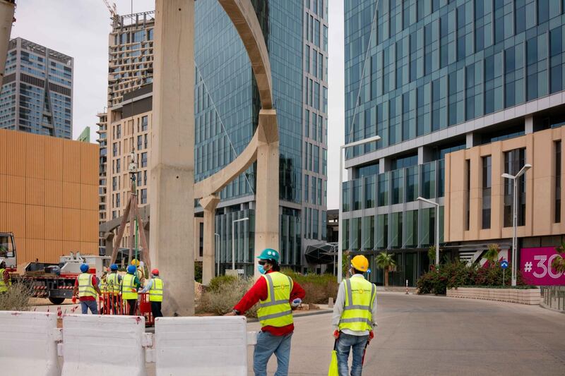 Construction workers operate at a development site in the King Abdullah Financial District (KAFD) in Riyadh, Saudi Arabia, on Tuesday, May 19, 2020. Hit simultaneously by plunging crude prices and coronavirus shutdowns, the non-oil economy is expected to contract for the first time in over 30 years. Photographer: Tasneem Alsultan/Bloomberg