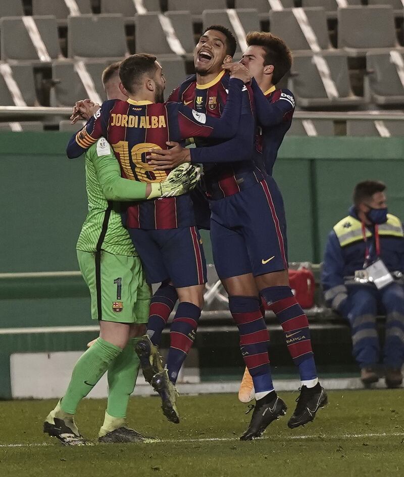 Barcelona players celebrate their victory over Real Sociedad. EPA