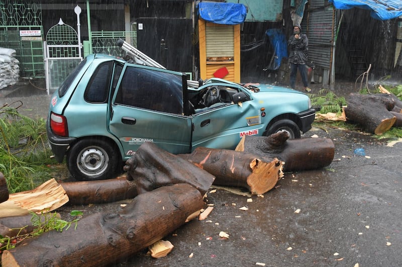 A falling tree caused serious damage to a car as cyclone Tauktae blew through Mumbai, India. EPA