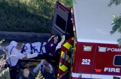 A man who was placed in handcuffs by police is loaded into a paramedic vehicle after a shooting incident at Marjory Stoneman Douglas High School in Parkland, Florida, U.S. February 14, 2018 in a still image from video.  WSVN.com via REUTERS. ATTENTION EDITORS - THIS IMAGE HAS BEEN PROVIDED BY A THIRD PARTY. NO RESALES, NO ARCHIVES. MANDATORY CREDIT. NO ACCESS SOUTHEAST FLORIDA MEDIA.