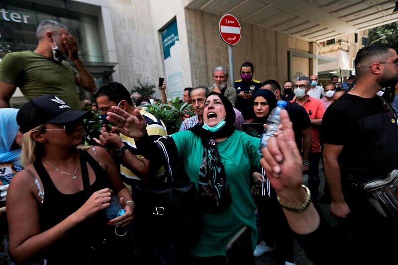 Former employees of the American University Medical Centre react during a demonstration outside the hospital in the capital Beirut. AFP