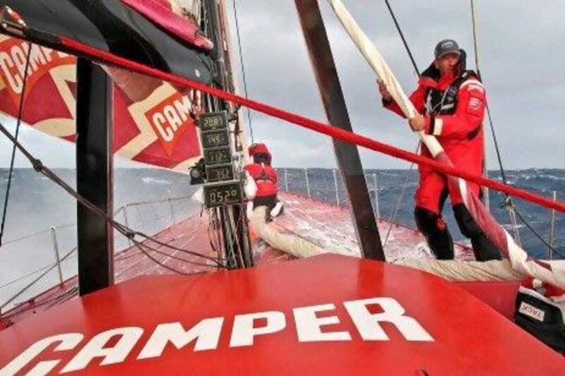 Rob Salthouse manages on the foredeck during a sail change onboard Camper.