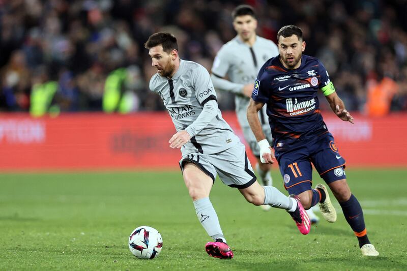 Paris Saint-Germain's Argentine forward Lionel Messi fights for the ball with Montpellier's French midfielder Teji Savanier. AFP