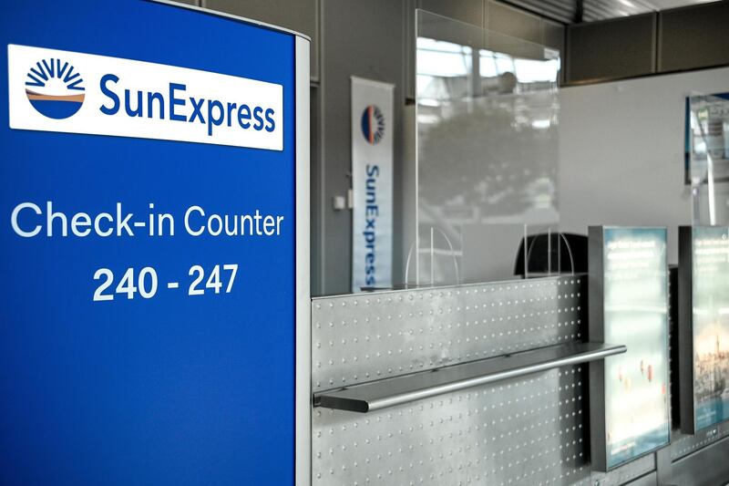 epa08504186 An empty check-in counter of German airline SunExpress at the International Airport in Duesseldorf, Germany, 23 June 2020. Due to the coronavirus crisis, Lufthansa is closing down the flight operations of its subsidiary Sun Express Germany with around 1200 employees. The remaining flights are to be handled by the Turkish sister company, Eurowings and other airlines, the company announced.  EPA/SASCHA STEINBACH