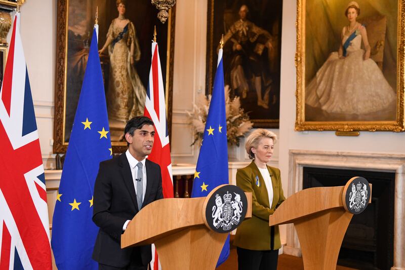 Rishi Sunak and Ursula von der Leyen announce the agreement at the Windsor Guildhall in a room adorned with portraits of royal family members. EPA