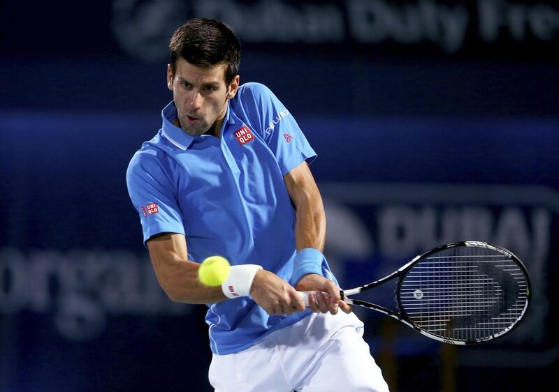 Novak Djokovic of Serbia plays a backhand against Marsel Ilhan of Turkey during their quarter-final match at the Dubai Duty Free Tennis Championships on February 26, 2015. Francois Nel/Getty Images