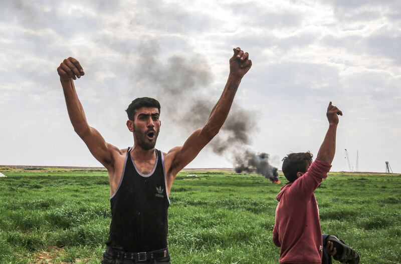 Palestinians demonstrate along along the Gaza-Israel border east of Khan Yunis in the southern Gaza Strip.  AFP